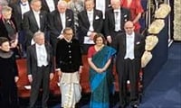 Indian American Economist with his wife seen in Indian attire during Award ceremony